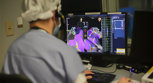 physician examining a MRI scan