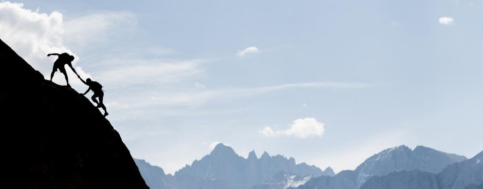 couple climbing mountain